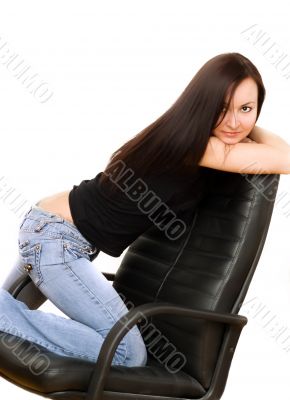 Girl in jeans on chair