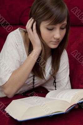  female teenager reads book