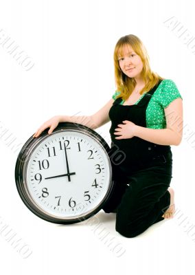 pregnant woman with a clock