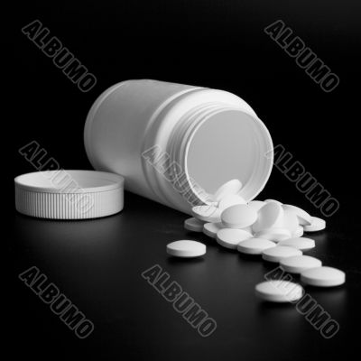 bottle with white pills