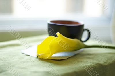 a cup of coffee and a calla