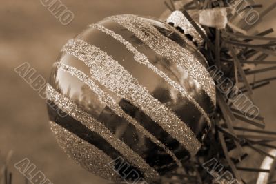 Christmas Decoration Textured Red and Silver Bauble sepia