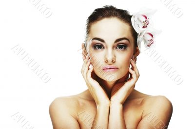Beautiful portrait of a  sexy woman with bright white flowers.
