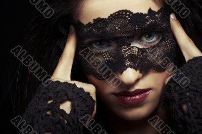 woman dressed in mourning clothes, face partially covered