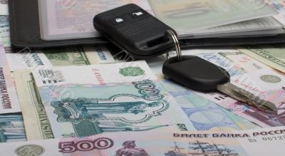 Documents on the car and money.