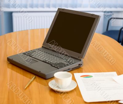 Laptop on a table at office