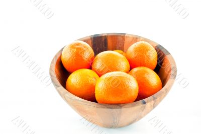 wood dish full with oranges