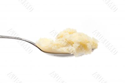 Spoon with mashed potatoes left