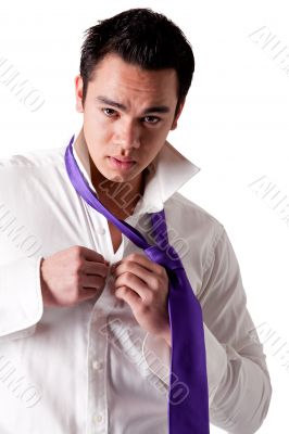 Portrait of a strong young indonesian clothing himself