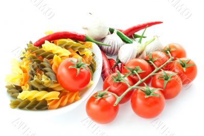 multicolored pasta, pepper, tomato bunch and garlic