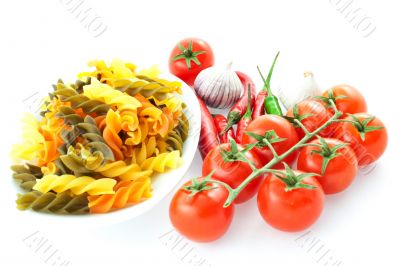 multicolored pasta, pepper, tomato bunch and garlic