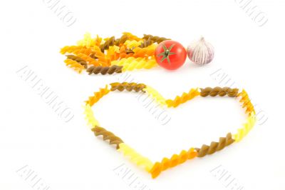 multicolored pasta, tomato and garlic