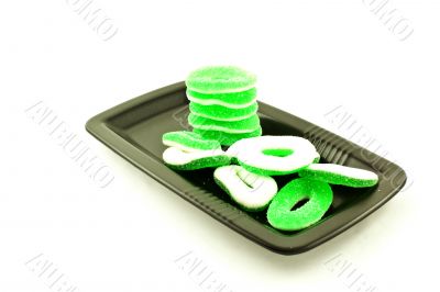 bright color sweets on a black square plate