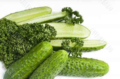 Cutted and whole  cucumbers and parsley, healthy food isolated o