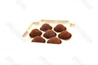 seven truffles in an open box