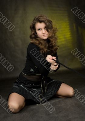 Girl in black on dark background