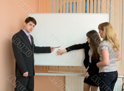Office workers discuss work