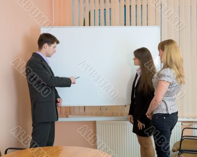 Office workers discuss work