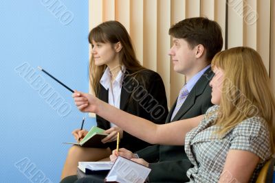 Group of businessmen sitting on armchairs