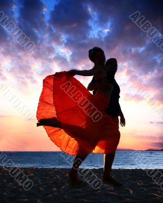 Couple dancing at sunset