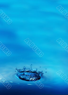 The drop of water, falls downwards...