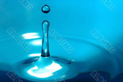 The drop of water, falls downwards...