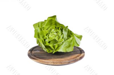 Healthy vegetables isolated on a wooden cutting board
