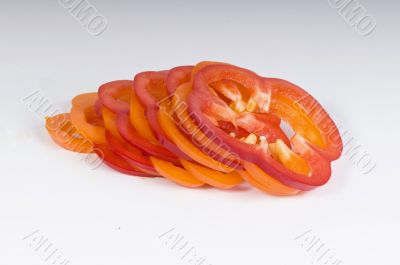 Sliced sweet red and yellow peppers isolated on white