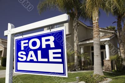 For Sale Real Estate Sign and House