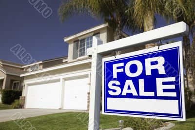 For Sale Real Estate Sign and House