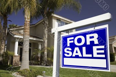 For Sale Real Estate Sign and House
