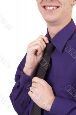 Businessman fixing his tie