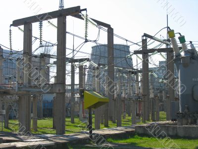 High voltage electric converters and cooling towers at a power plant