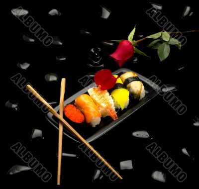 assorted sushi plate and rose