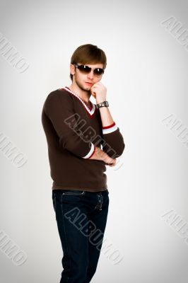 blonde man in modern sweater and sunglasses