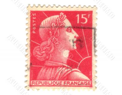Old red french postage stamp with woman