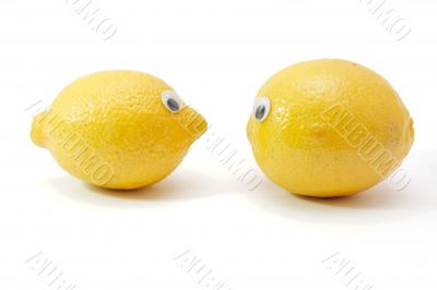 Two funny lemons with eyes on white