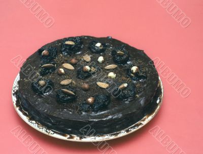 Black chocolate cake on red