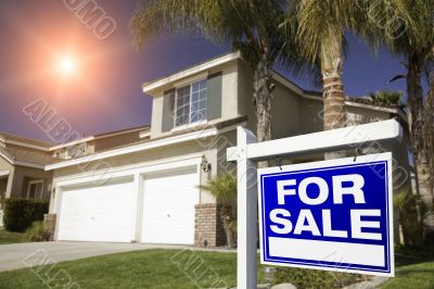 Red For Sale Real Estate Sign and House