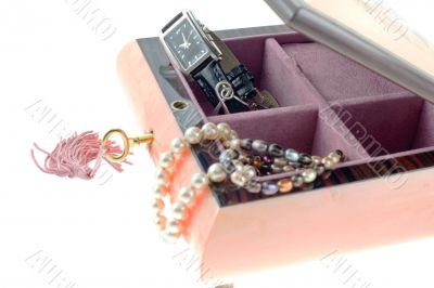 pearl necklaces and watch in open encrusted box