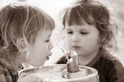 Two boys by the drinking fountain