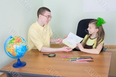 Girl shows new drawing to the brother