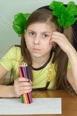 Girl with colour pencils in hands
