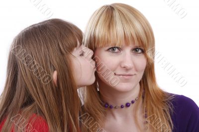 Daughter kissing her happy mother. I love my mom.