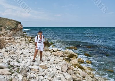 A happy woman at the seashore.