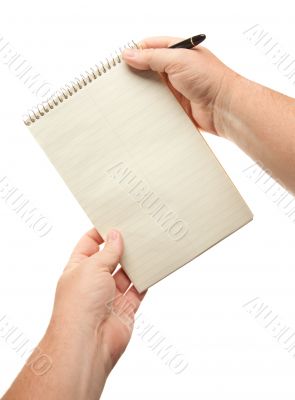 Male Hands Holding Pen and Pad of Paper