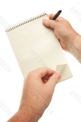 Male Hands Holding Pen and Pad of Paper
