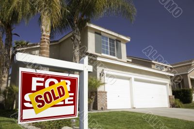 Red Sold For Sale Real Estate Sign and House