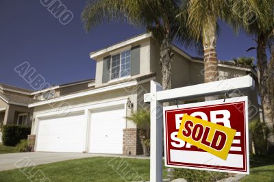 Red Sold For Sale Real Estate Sign and House