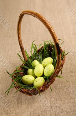 Basket with Easter eggs and grass